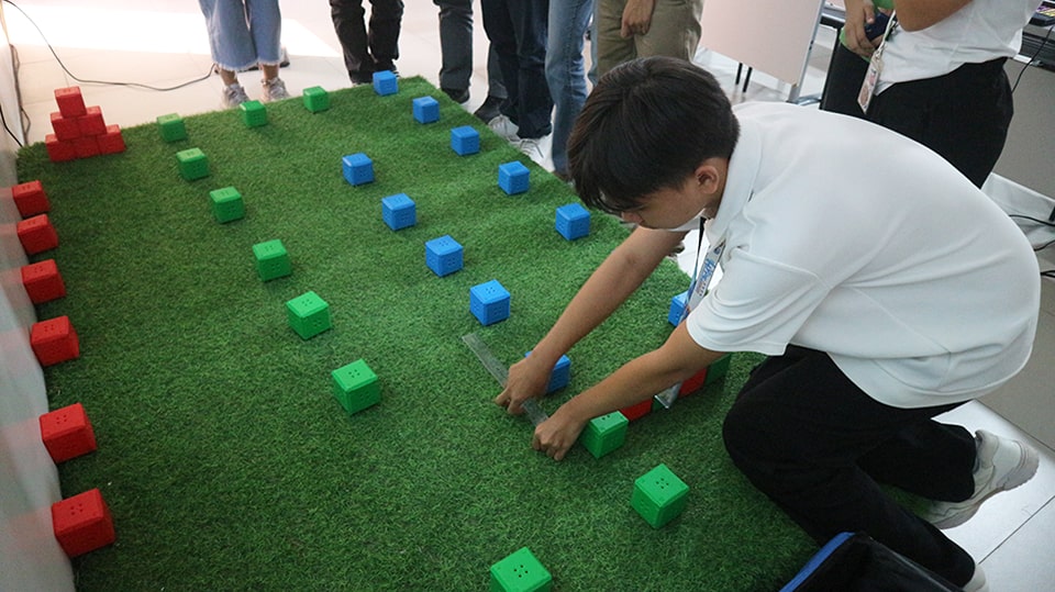 Students study the activity field for the agri-robotics challenge.
