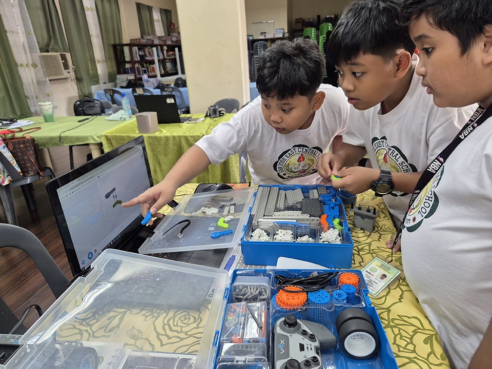 Grade schoolers build a BaseBot using online instructions.